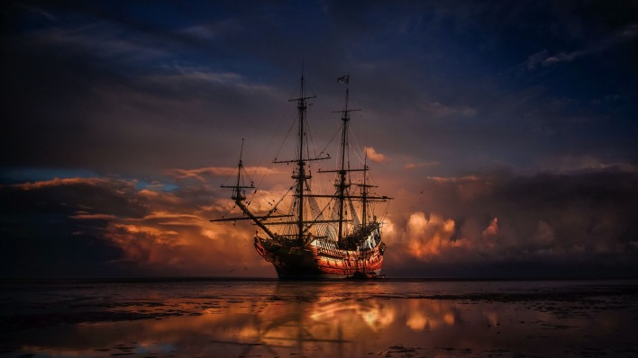 корабль парусник на закате море