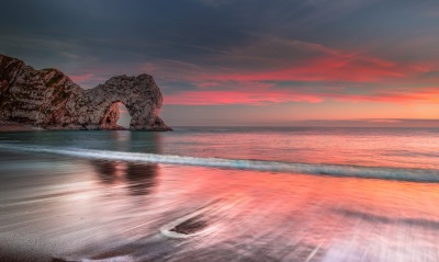 скалы арка закат море