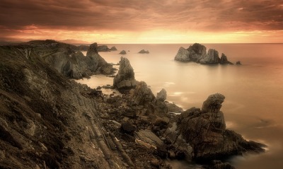 скалы берег море на закате камни