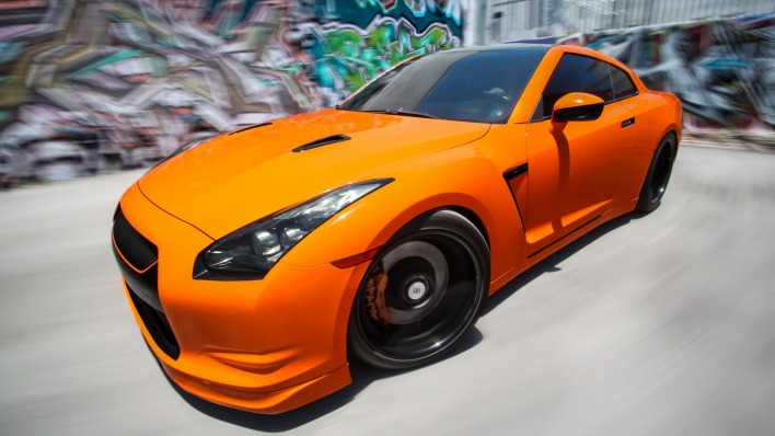оранжевые спортивный автомобиль Nissan Skyline GTR R35