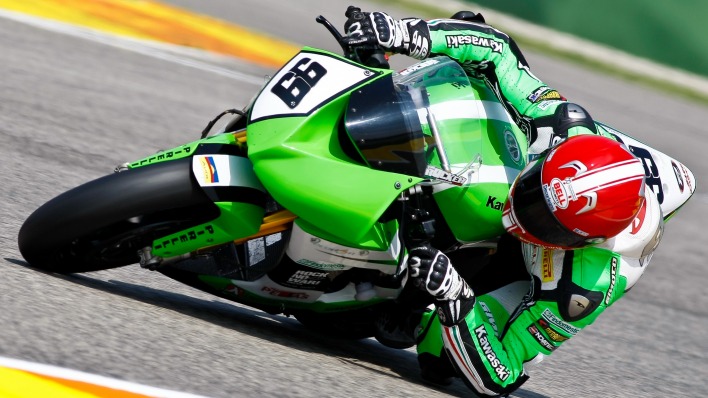 мотоцикл зеленый вираж гонщик