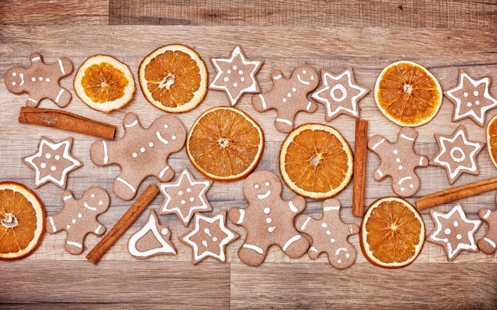 рождественский фон печенье апельсины палочки корицы