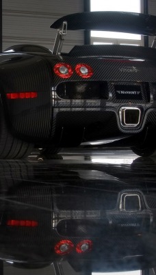 черный спортивный автомобиль bugatti veyron mansory