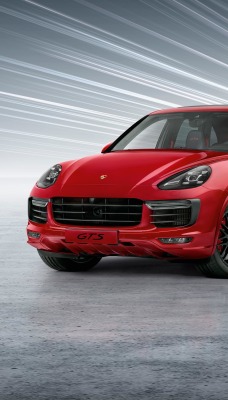 красный автомобиль Porsche Cayenne GTS