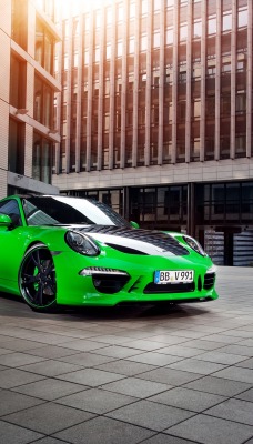 спортивный автомобиль зеленый porsche 911 carrera 4s