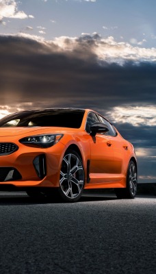 kia оранжевый автомобиль на закате