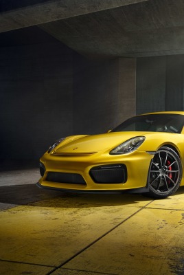 желтый спортивный автомобиль porsche cayman gt4 yellow sports car