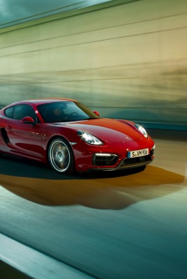 красный автомобиль porsche cayman gts