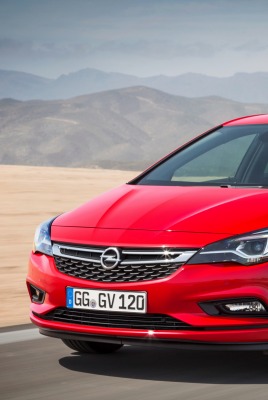 Opel Astra хетчбэк песок горы дорога