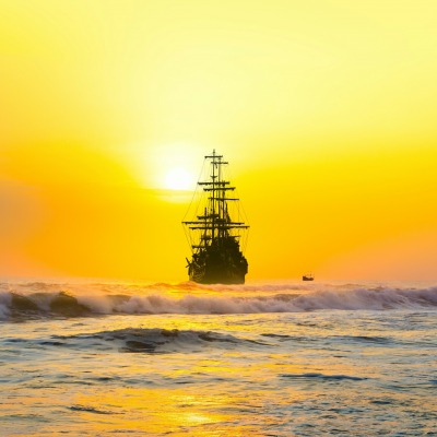 корабль волны солнце желтый закат